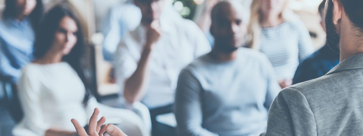 Business,Coach.,Rear,View,Of,Man,Gesturing,With,Hand,While